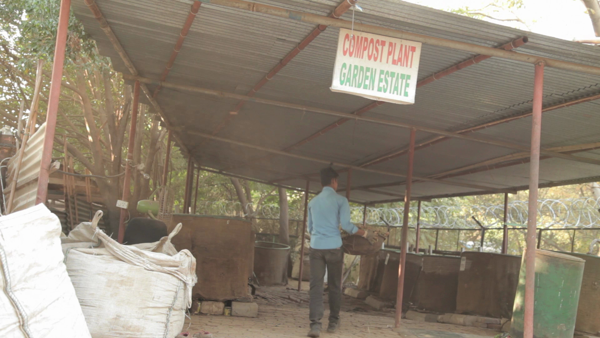 Do-it-yourself, steel wire mesh bin system of aerobic, natural composting at Garden Estate